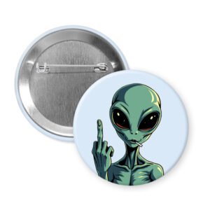 Pin button with an alien design showing a middle finger on a light blue background