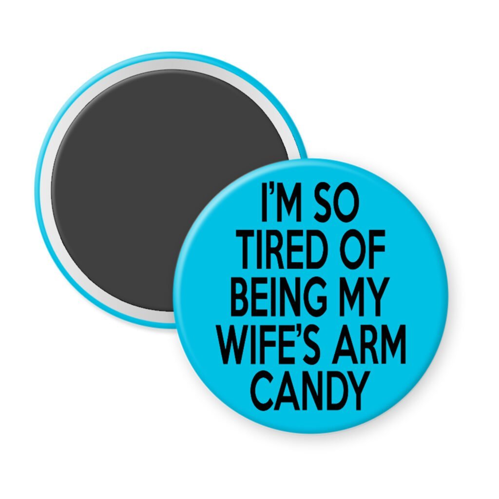 Blue magnet with text 'I'm so tired of being my wife's arm candy' printed in black.