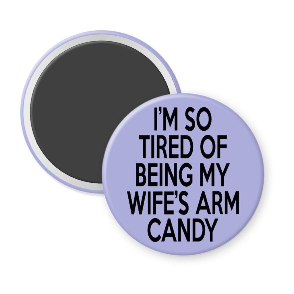 Purple magnet with text 'I'm so tired of being my wife's arm candy' printed in black.