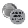 Grey pinback button with text 'Ask me about my tiny penis' printed in black.