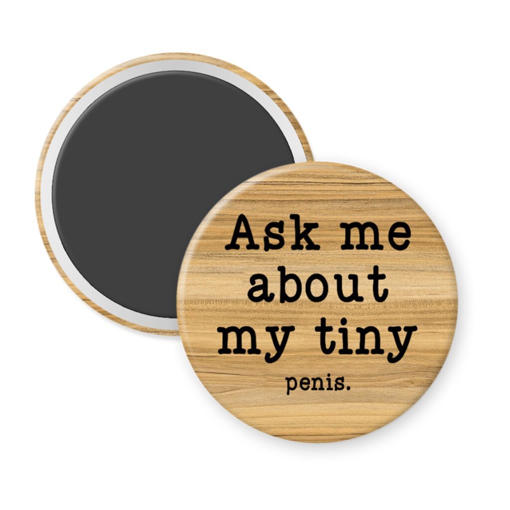 Wood grain print magnet with text 'Ask me about my tiny penis' printed in black.
