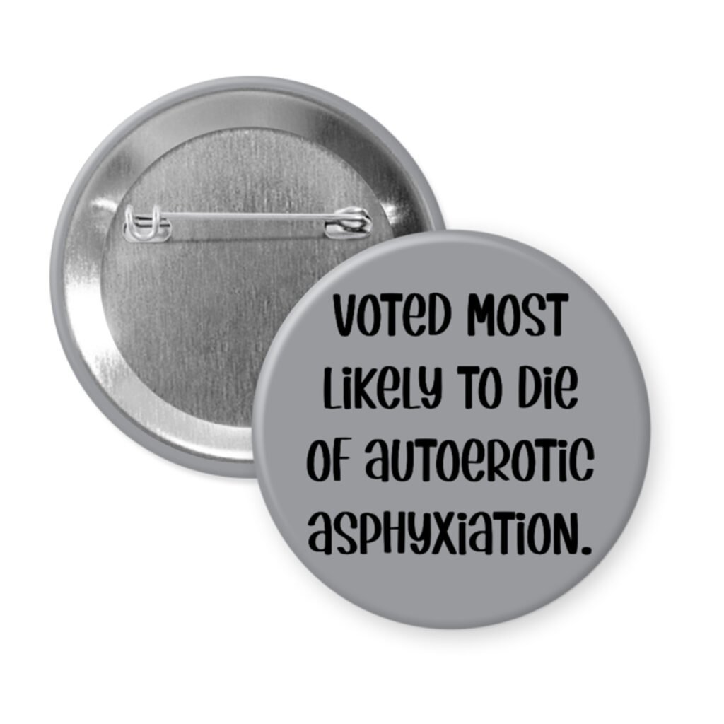 Grey pinback button with the text 'Voted most likely to die of autoerotic asphyxiation.' printed in black.