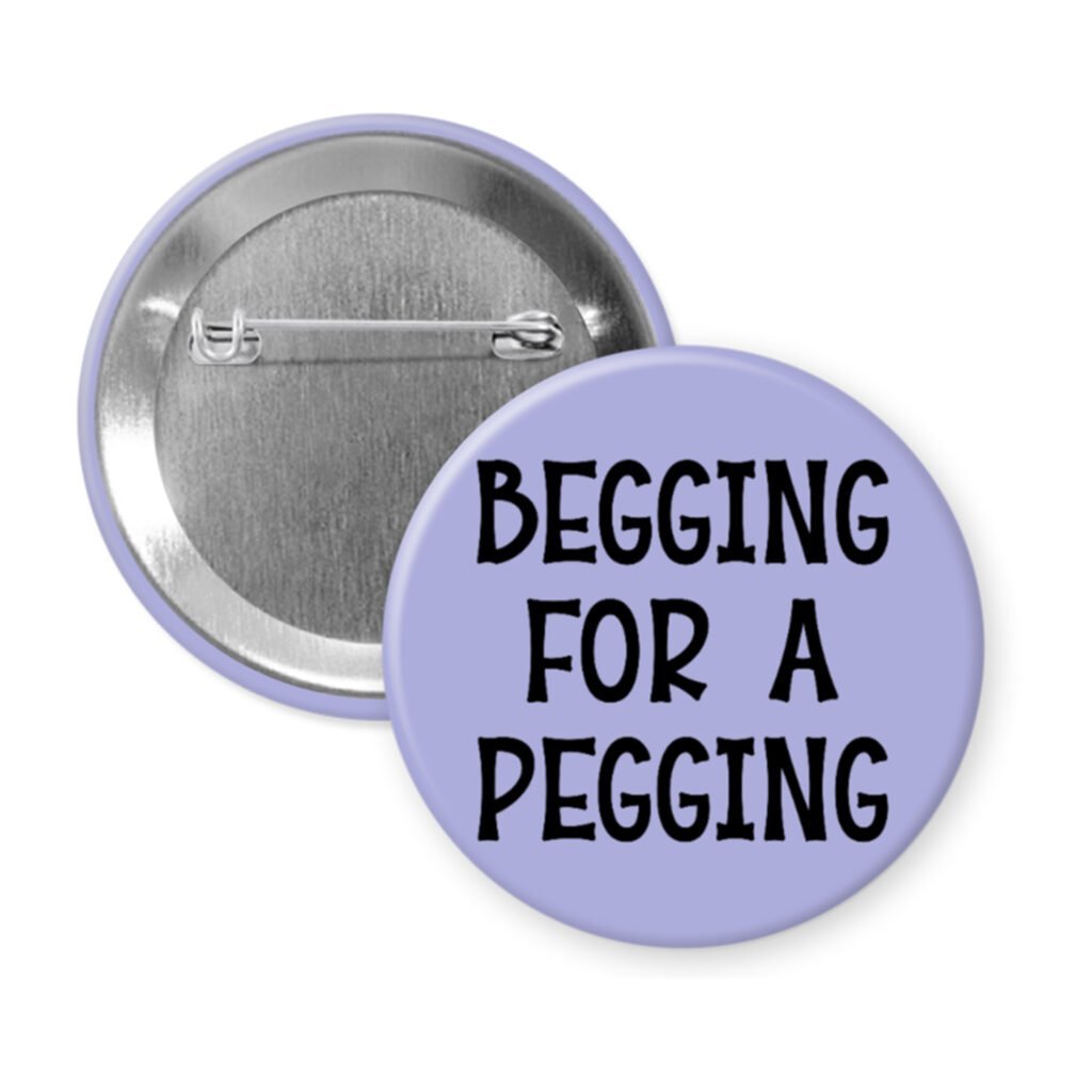 Purple pinback button with the text 'Begging for a pegging' printed in black.