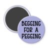 Purple magnet with the text 'Begging for a pegging' printed in black.