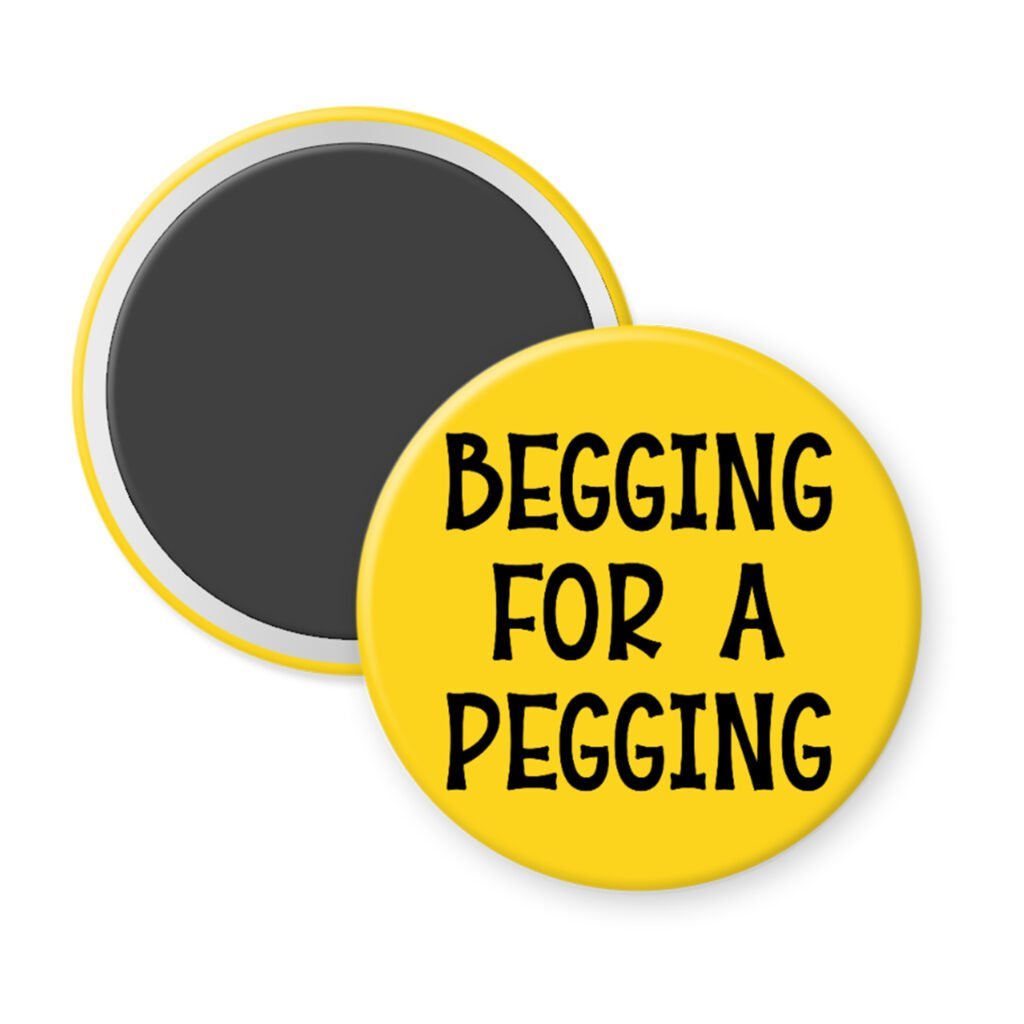 Yellow magnet with the text 'Begging for a pegging' printed in black.