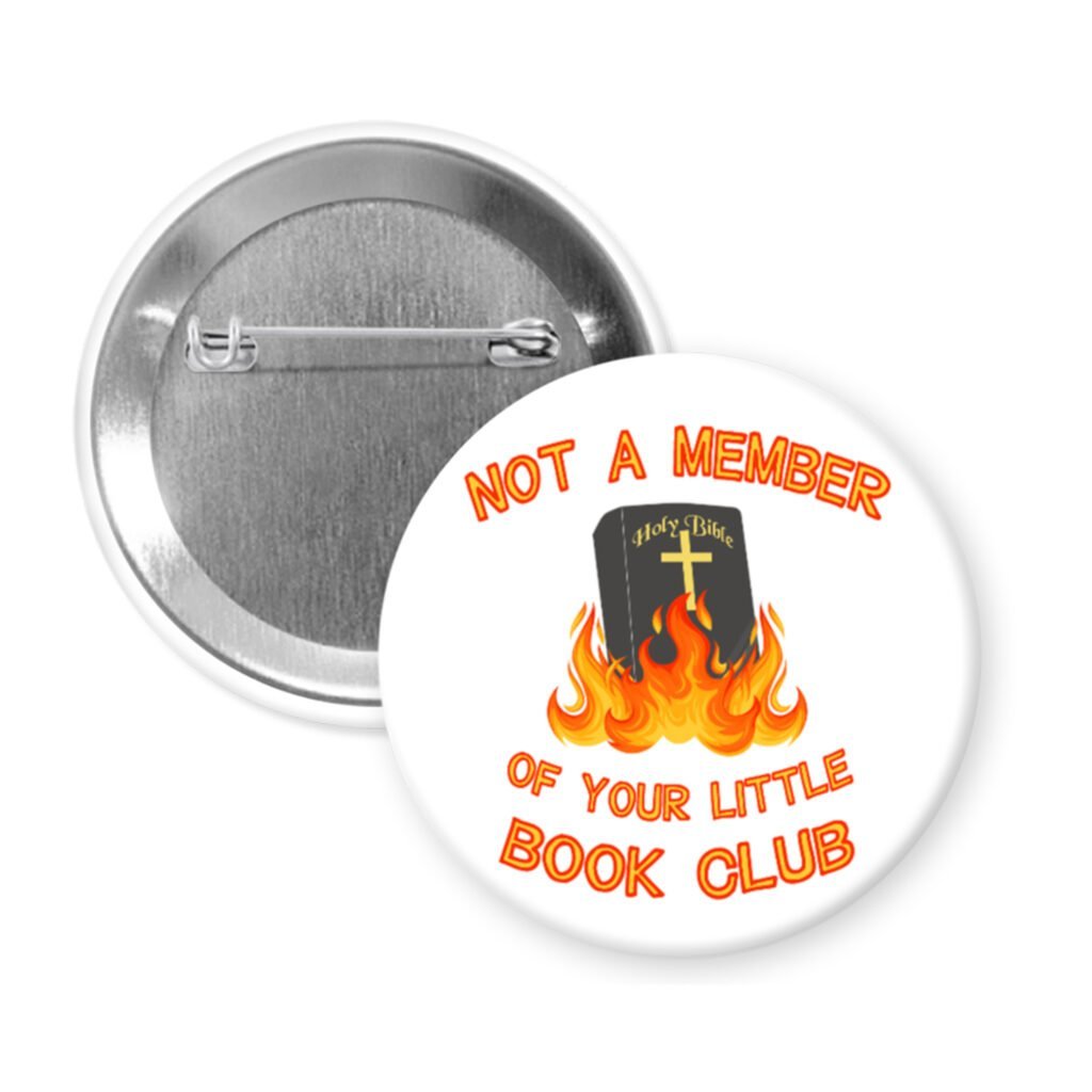 Button badge with a Bible on fire and text 'Not a member of your little book club' on a white background.