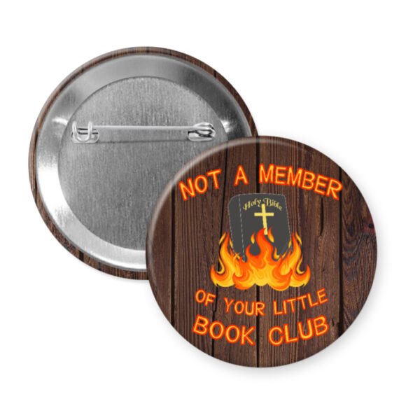 Button badge with a Bible on fire and text 'Not a member of your little book club' on a wood print background.