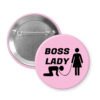 Pink pinback button with graphic of collared and leashed man on his hands and knees being led by a woman and the words Boss lady.