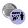 Purple pinback button with a graphic of a collared and leashed man on hands and knees, a woman figure holding the leash with the text 'BOSS LADY' printed in black.