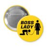 Yellow pinback button with a graphic of a collared and leashed man on hands and knees, a woman figure holding the leash with the text 'BOSS LADY' printed in black.