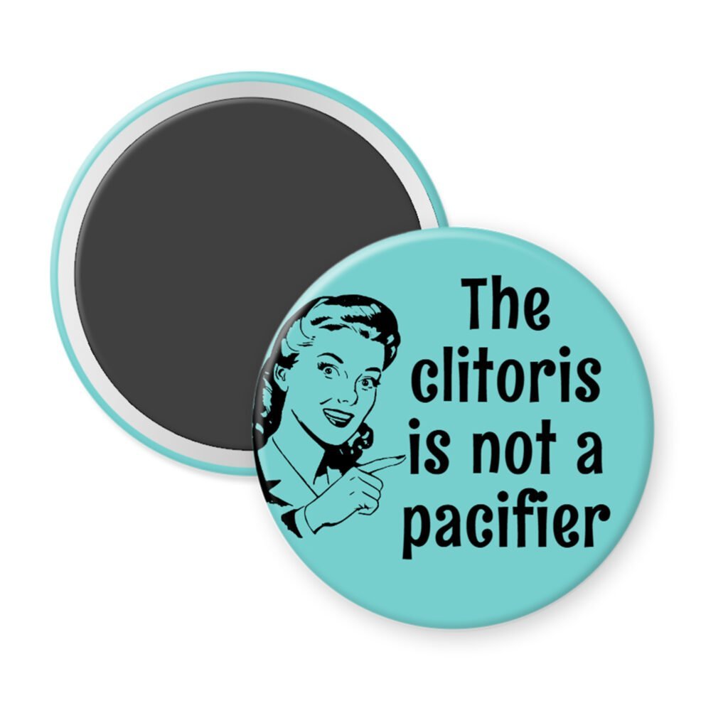 Blue magnet with vintage woman graphic and the words "The clitoris is not a pacifier".