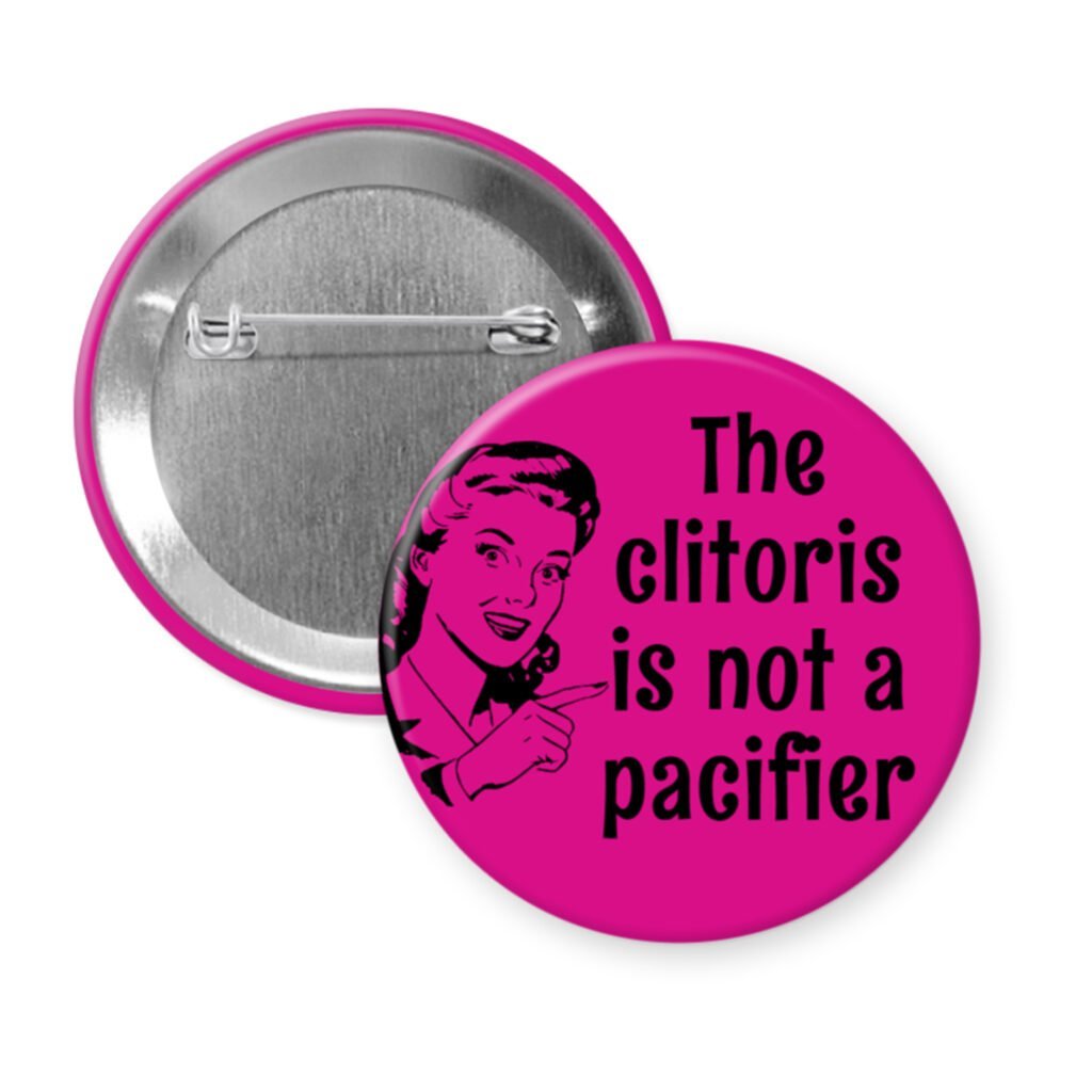Fuchsia button with vintage woman graphic and the words "The clitoris is not a pacifier".