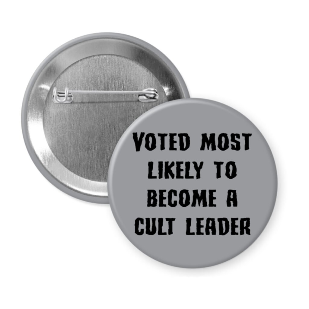 Grey pinback button with the text 'Voted most likely to become a cult leader' printed in black.
