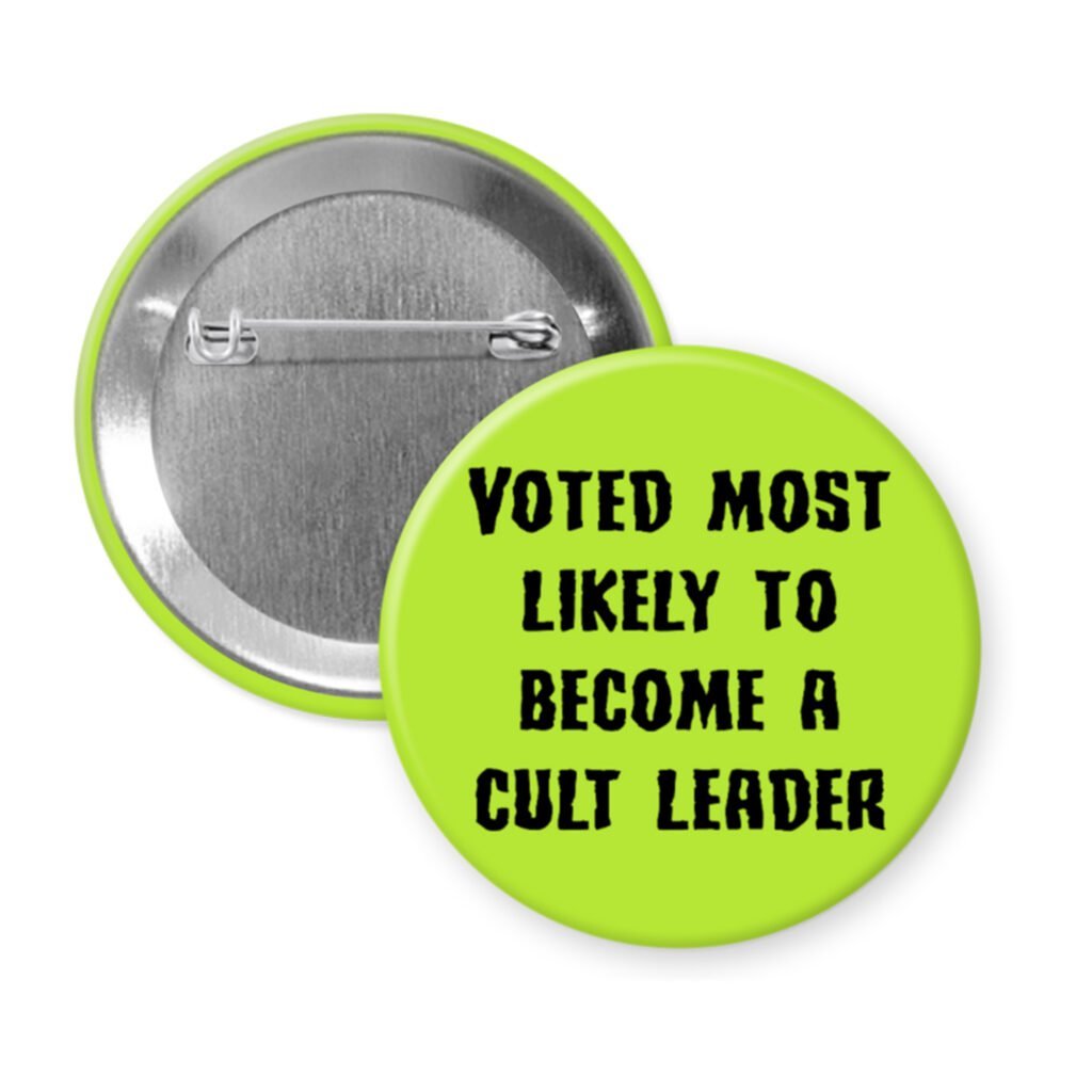 Green pinback button with the text 'Voted most likely to become a cult leader' printed in black.