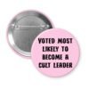 Pink pinback button with the text 'Voted most likely to become a cult leader' printed in black.