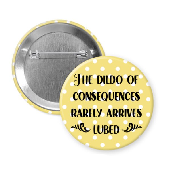 Dildo of consequences button badge with yellow polka dot background and black text on a white background