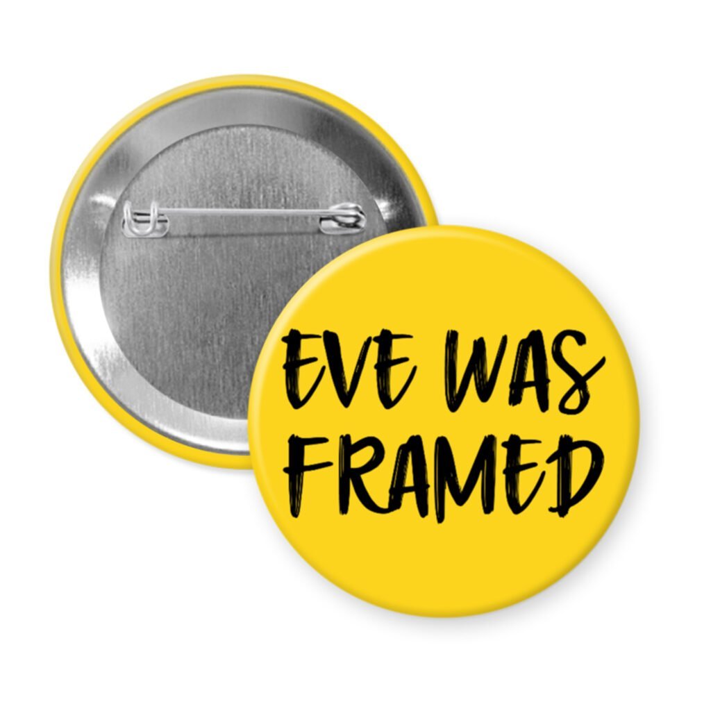 Yellow pinback button with the text 'Eve was framed' printed in black.
