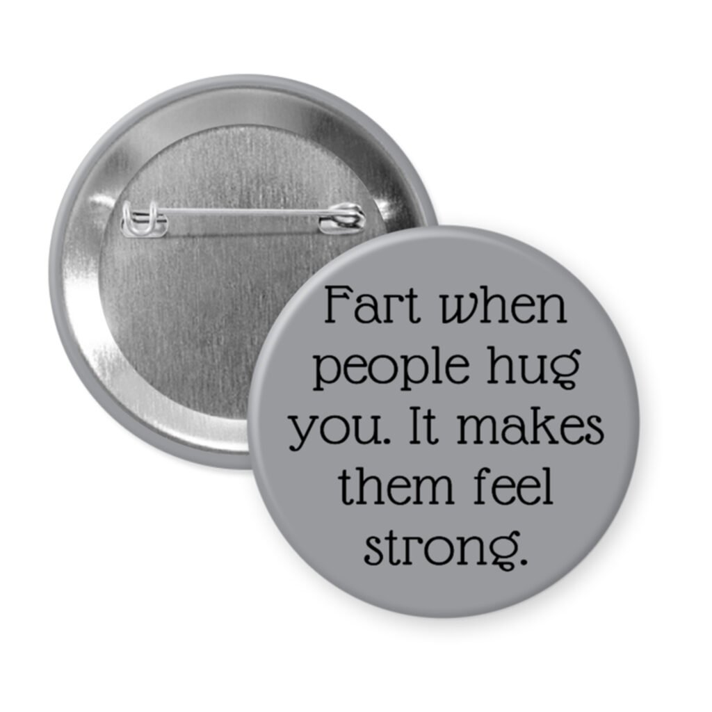 Grey pinback button with the text 'Fart when people hug you. It makes them feel strong.' printed in black.