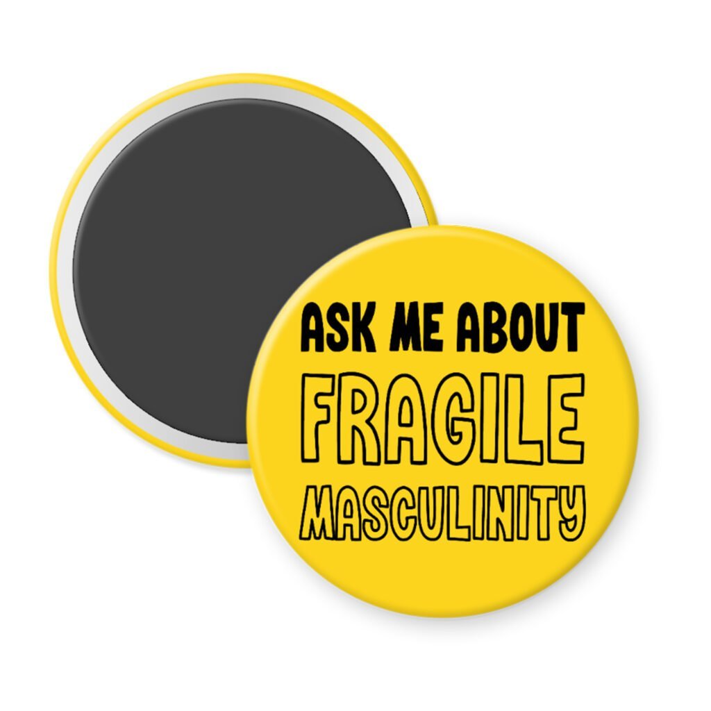 Yellow magnet with the text 'Ask me about fragile masculinity' printed in black.