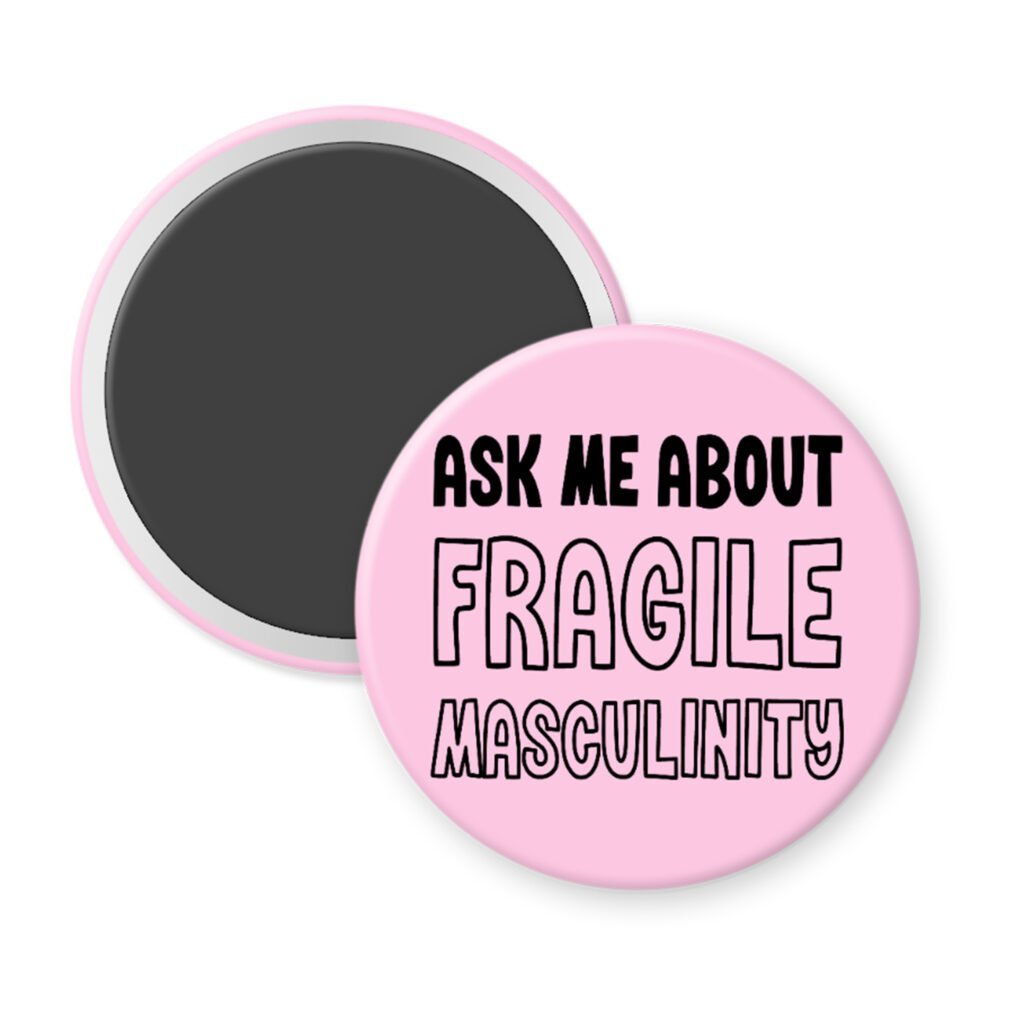 Pink magnet with the text 'Ask me about fragile masculinity' printed in black.