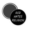 Magnet with 'GOD HATES RELIGION' text on a black background