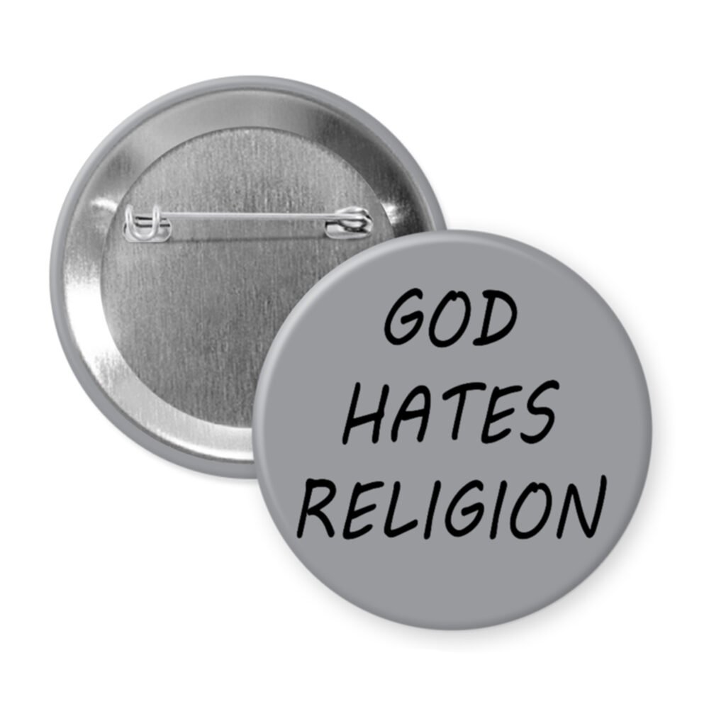 Grey pinback button with the text 'God hates religion' printed in black.