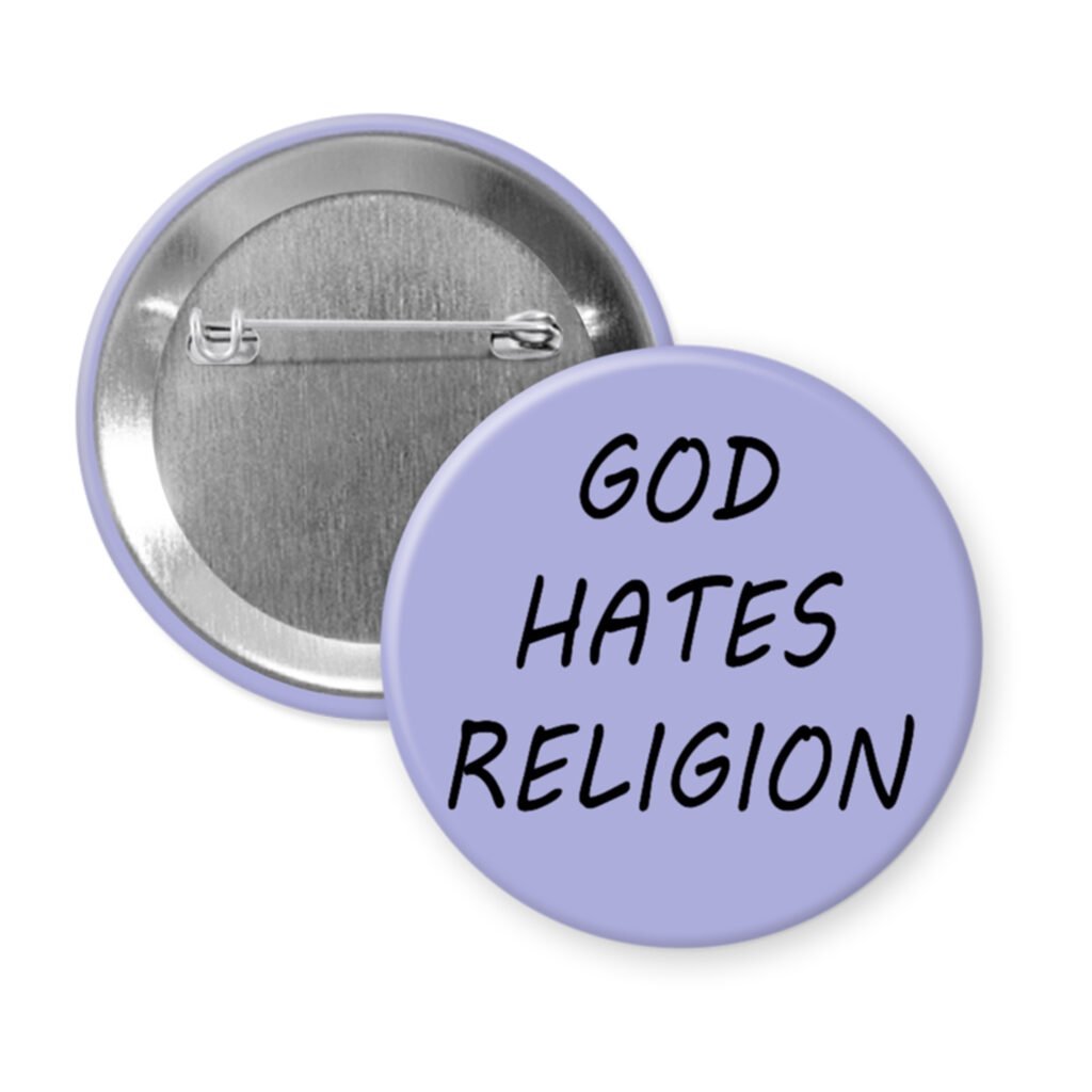 Purple pinback button with the text 'God hates religion' printed in black.