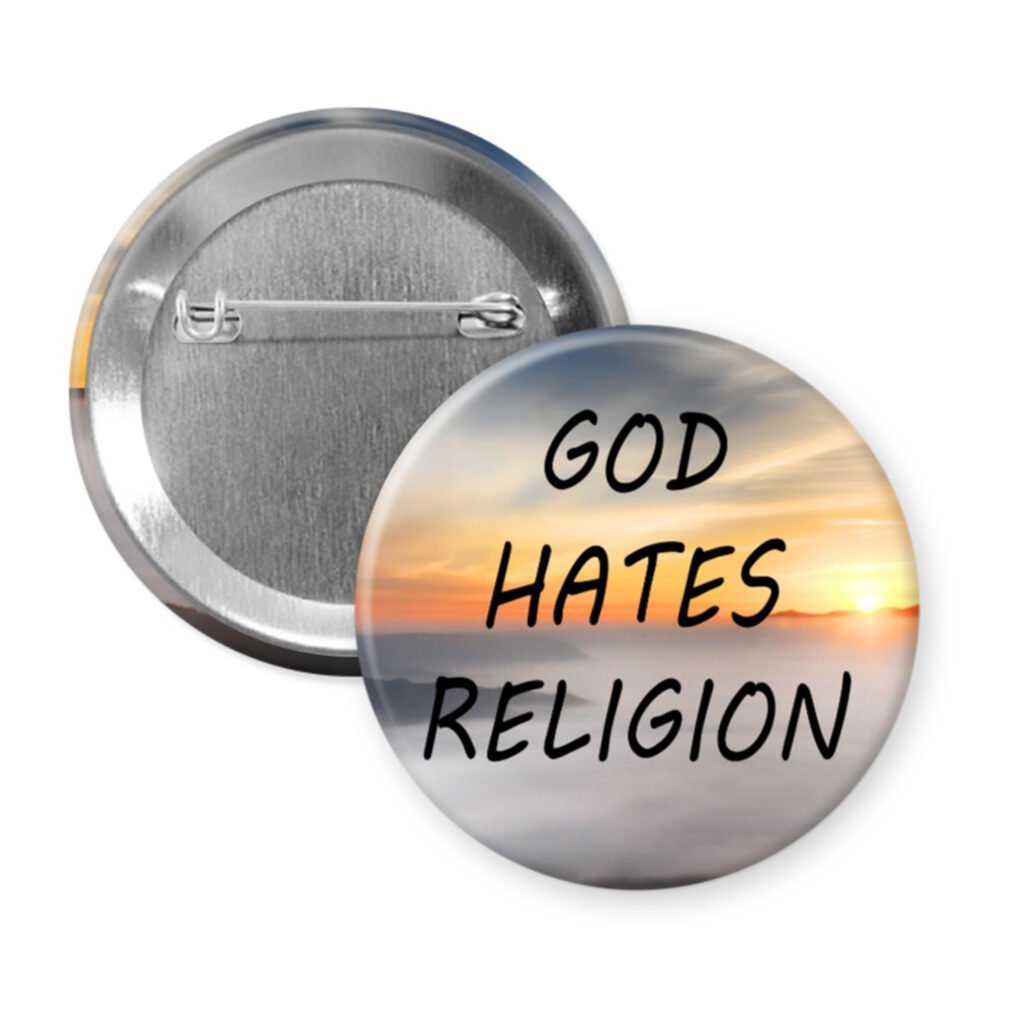 Button badge with 'GOD HATES RELIGION' text on a sunrise background