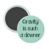 Mint green magnet with the text 'Gravity is such a downer' printed in black.