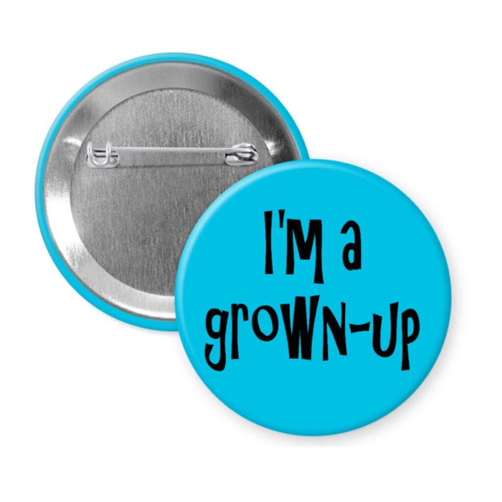 Blue pinback button with the text 'I'm a grown-up' printed in black.