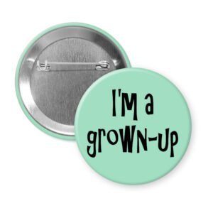 Mint green pinback button with the text 'I'm a grown-up' printed in black.