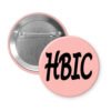 Peach button with 'HBIC' text on a white background
