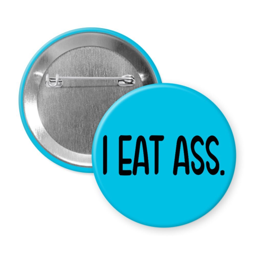Blue pinback button with the text 'I eat ass.' printed in black.
