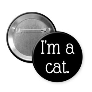 Black pinback button that says I'm a cat.