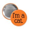Orange pinback button with the text 'I'm a cat.' printed in black.