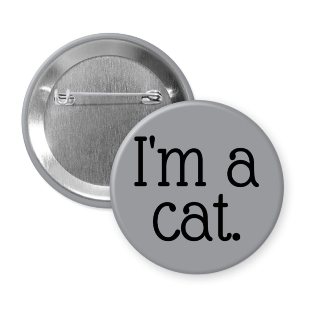 Grey pinback button with the text 'I'm a cat.' printed in black.