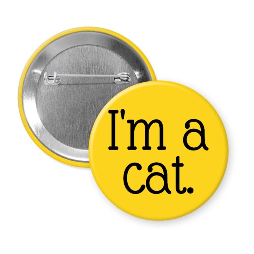 Yellow pinback button with the text 'I'm a cat.' printed in black.
