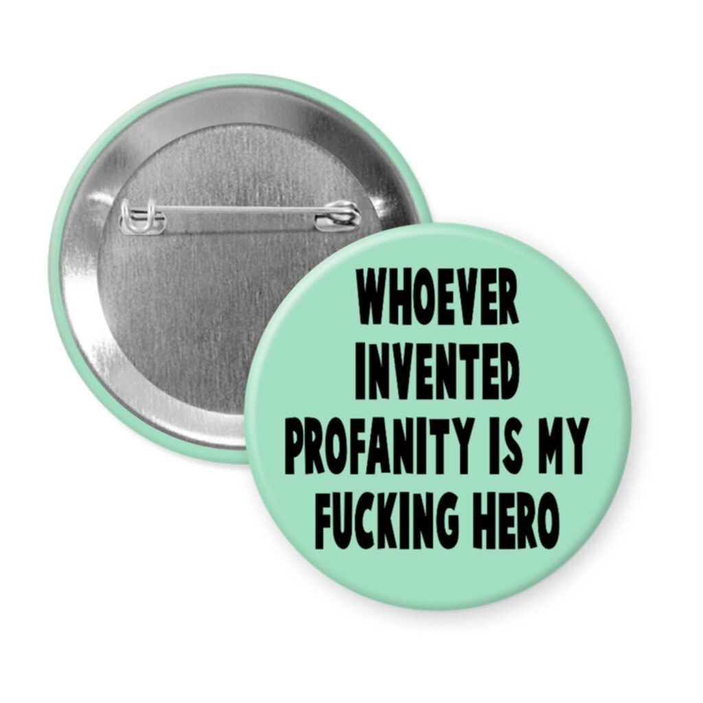 Green pinback button with the text 'Whoever invented profanity is my fucking hero.' printed in black.
