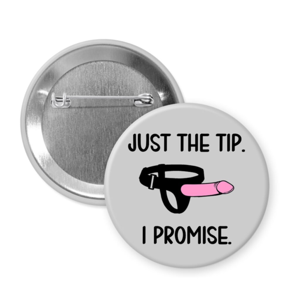 Pinback button with 'Just the tip. I promise.' text and ring illustration on a grey background