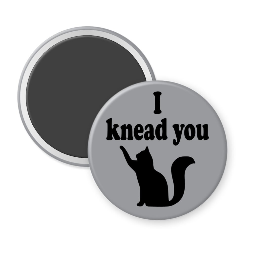 Grey magnet with silhouette of a cat and the text 'I knead you.'