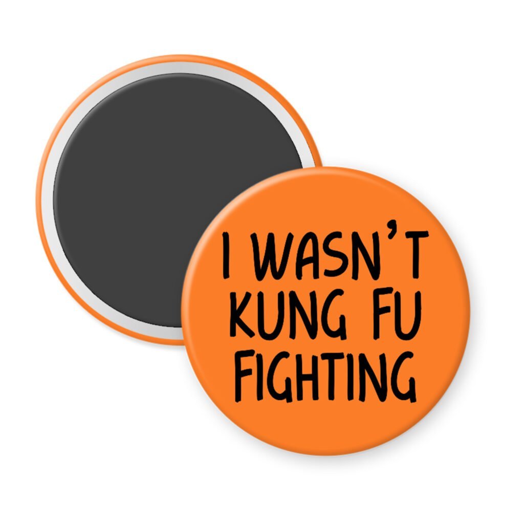 Orange magnet with the text 'I wasn't kung fu fighting' printed in black.
