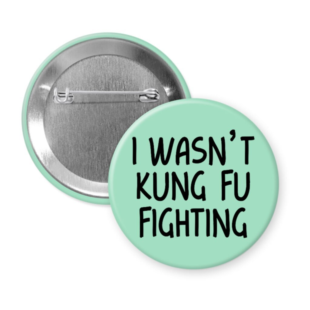 Green pinback button with the text 'I wasn't kung fu fighting' printed in black.