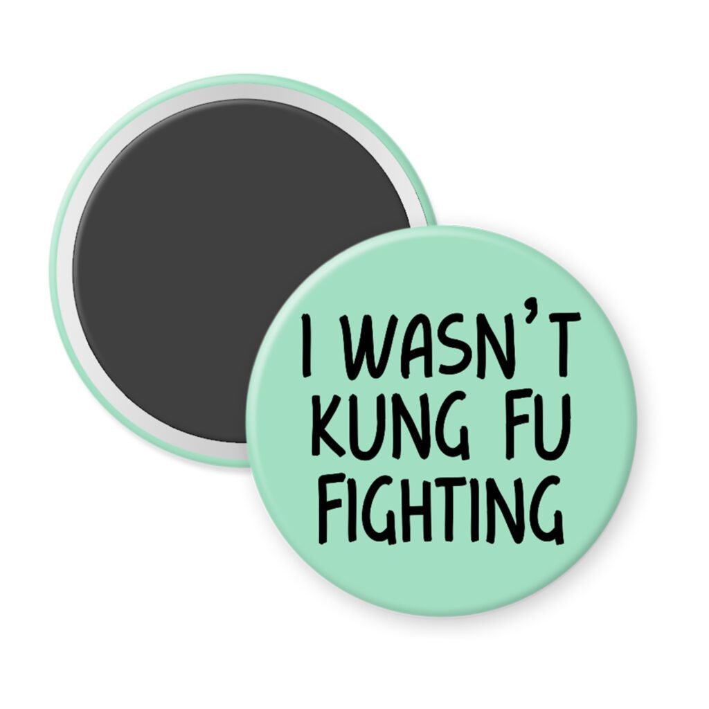 Green magnet with the text 'I wasn't kung fu fighting' printed in black.