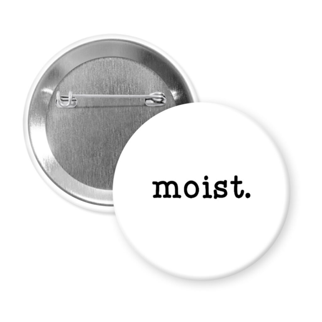 White pinback button with the text 'moist.' printed in black.