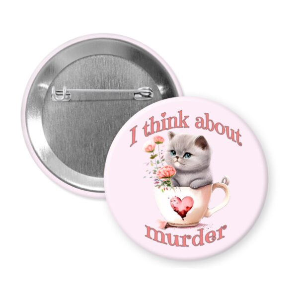Button badge with a cat illustration and text 'I think about murder' on a light pink background