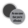 Grey magnet with the text 'No one cares that you're offended.' printed in black.