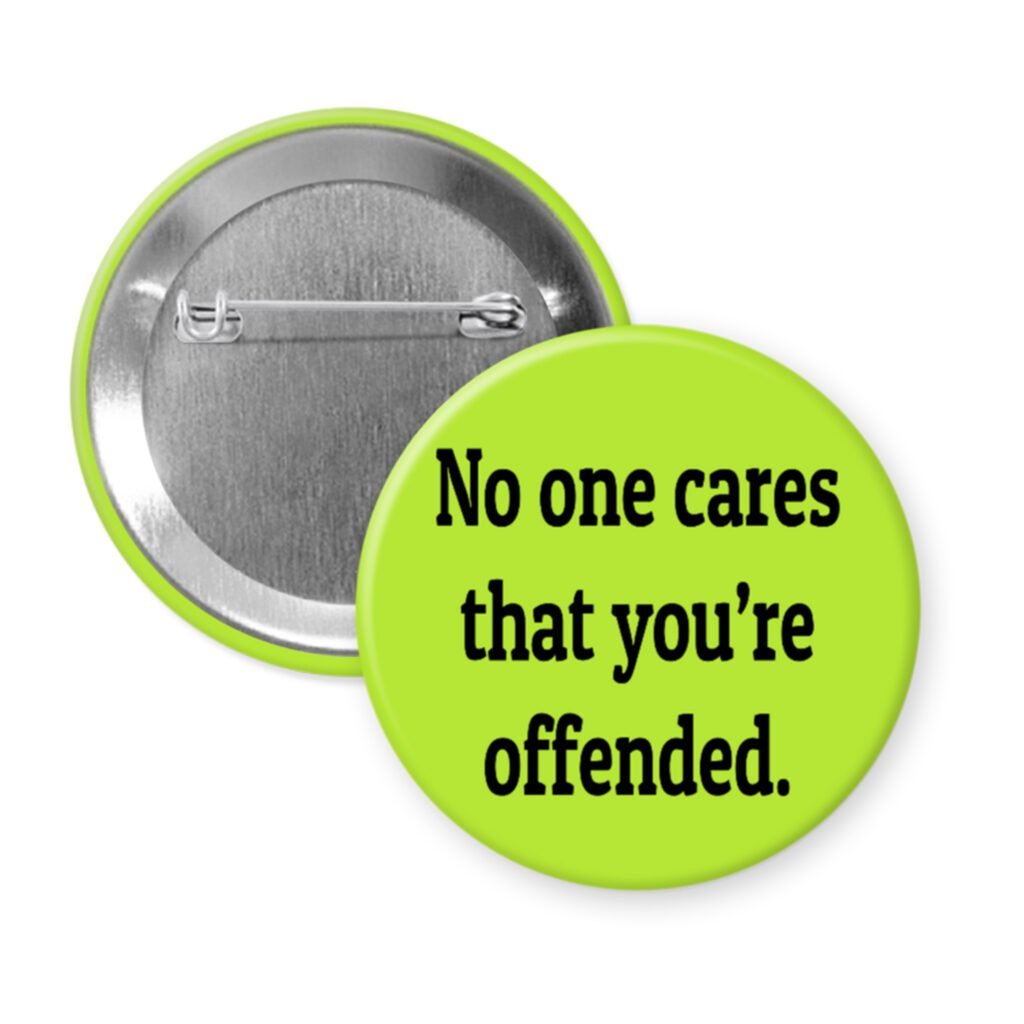 Green pinback button with the text 'No one cares that you're offended.' printed in black.
