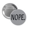 Grey pinback button with the text 'NOPE.' printed in black.