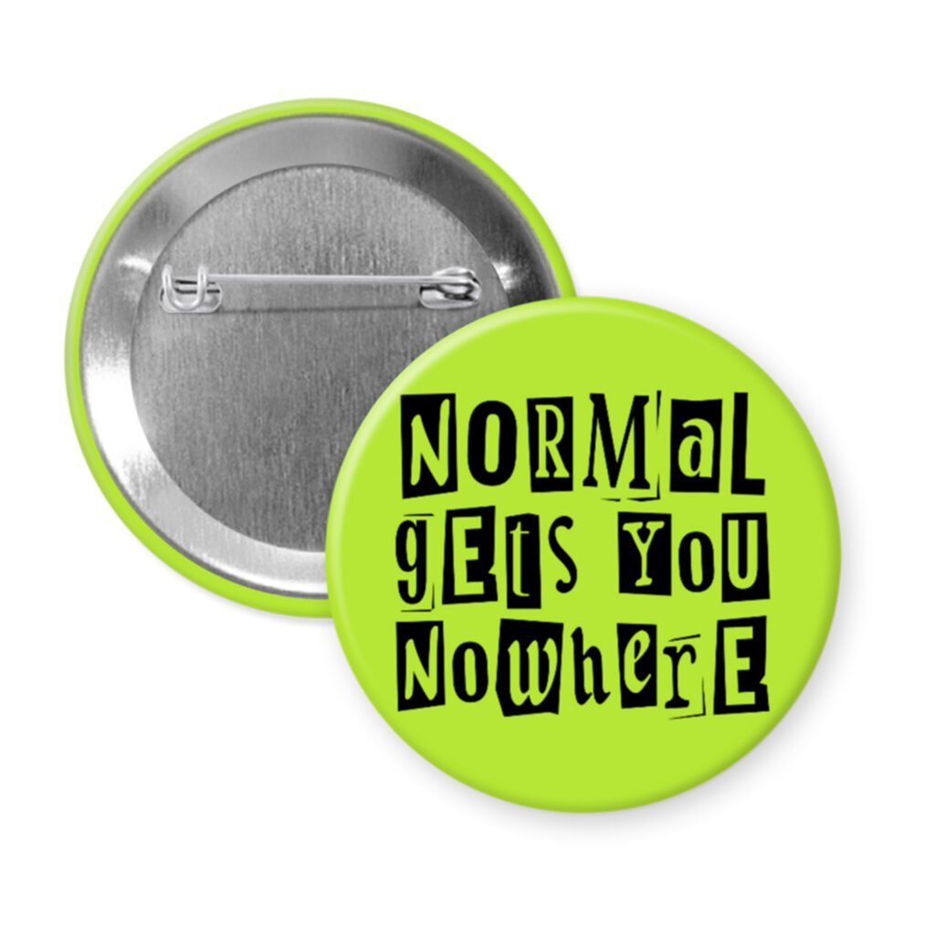 Green pinback button with the text "Normal gets you nowhere" printed in black stencil graffiti font.