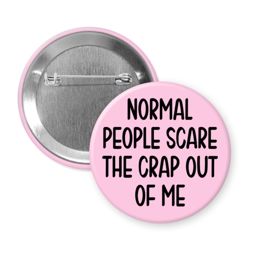 Pink pinback button with the text 'Normal people scare the crap out of me' printed in black.